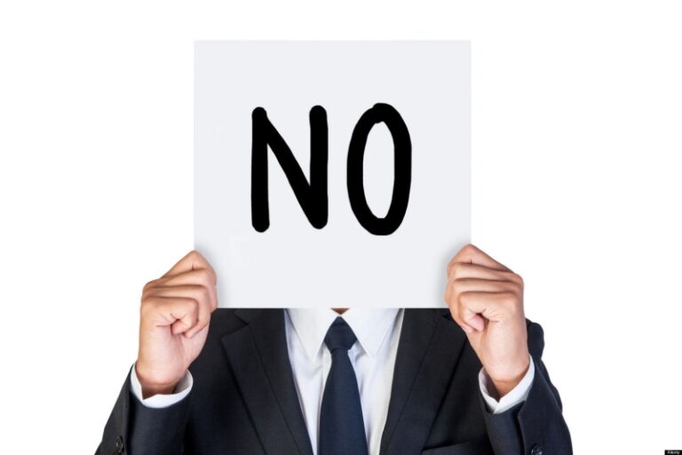 Businessman holding paper say no